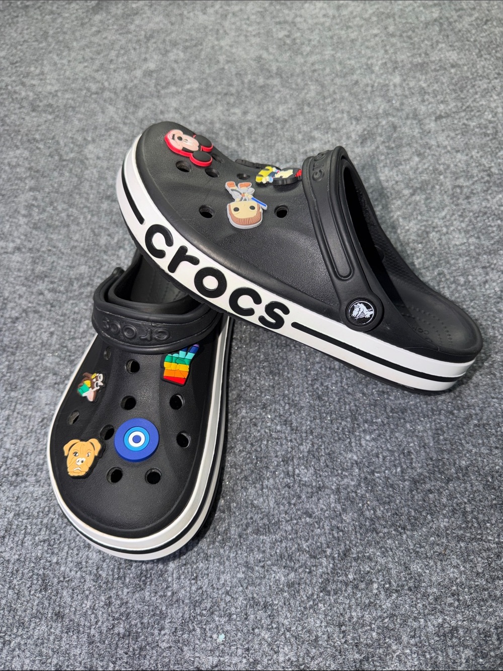 CROCS Unisex Black Slip-On Clogs with White Trim and Colorful Jibbitz